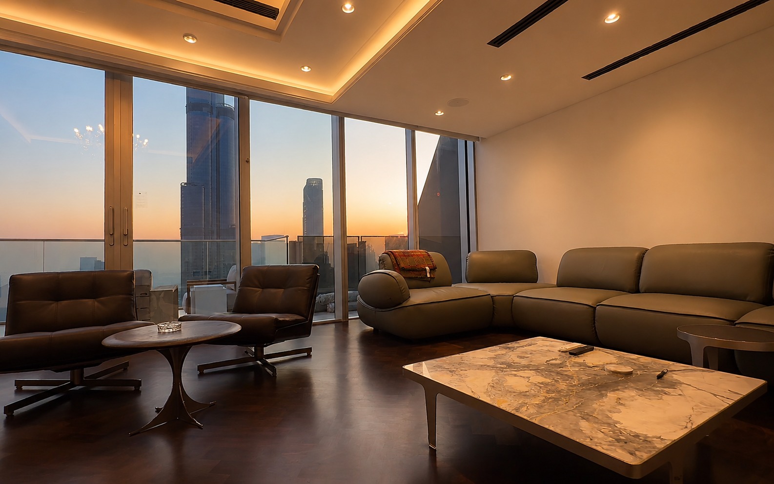 Living room with cove-lit ceiling and Downtown Dubai skyline at sunset